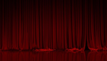 red curtain on theater or cinema stage.