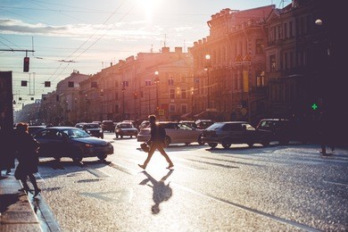 people crossing nevsky prospect. sunny evening in saint petersburg, russia. toned picture