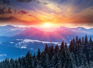 winter scene with sunset in mountains