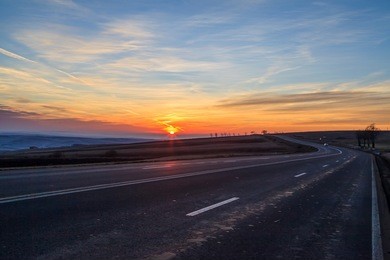 picturesque photo of country road and sunset