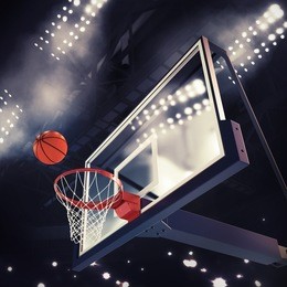 ball above the basket during basketball game