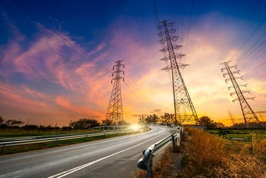 height voltage electricity pylon system on sunrise background