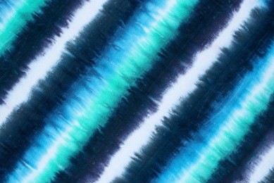 striped tie dyed pattern on cotton fabric abstract background. 