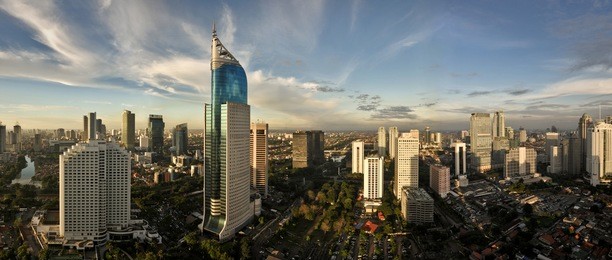 panoramic cityscape of indonesia capital city jakarta at sunset. a rare clear day in the polluted city.
