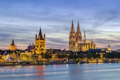 view of historical center of cologne from rhine river in evening, germany