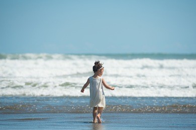 girl playing on the beach