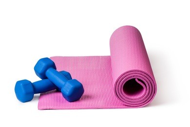 yoga mat and dumbbells isolated on white background