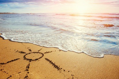 drawings in the sand on the beach.