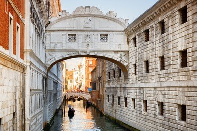 view of the bridge of sighs (ponte dei sospiri) and the rio de palazzo o de canonica canal from the riva degli schiavoni in venice, italy. the ponte de la canonica is visible in background.