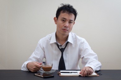 asian business man tired at work