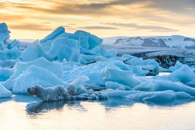 scenic view of icebergs in jokulsarlon glacier lagoon, iceland, at sunset