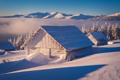 winter landscape with wooden house in the frost. mountain village of shepherds. carpathians, ukraine, europe