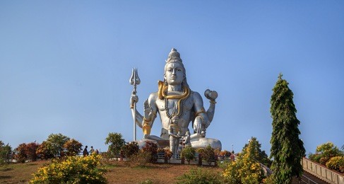 statue of lord shiva in murudeshwar, karnataka, india. the demon ravana gives shiva lingam ganesha in the form of the shepherd boy.