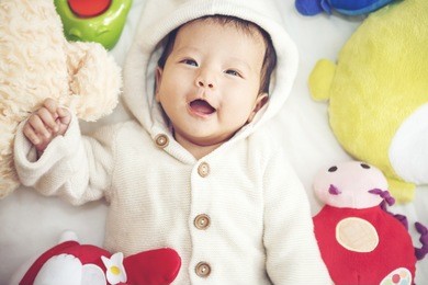 close up portrait of the baby indoor, new family and baby protection concept