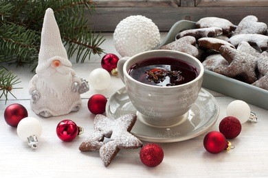 winter composition with tea and cookies