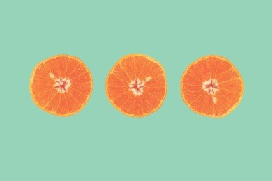 fashion orange on mint green background. summer color. minimalism.