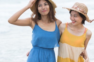 couples of asian woman relaxing at sea beach