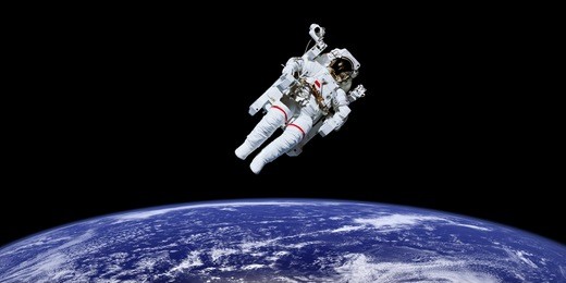 astronaut in outer space over the planet earth. 
this image is a collage of different images furnished by nasa