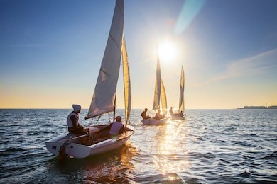 nice view of the sailboats in the sunset leaving