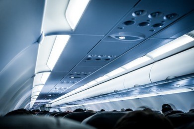blurred image of airplane interior in blue color filter
