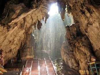 ancient batu caves in malaysia having a hindu temple inside