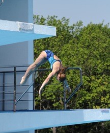the girl makes a jump in water