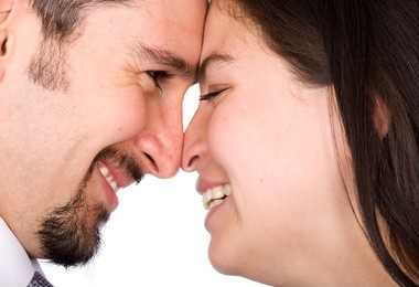 couple in love smiling and looking at each other - heads