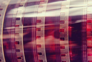closeup detail of vintage analog photography film strip background.
