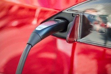 electric car charging process by power cable supply plugged in
