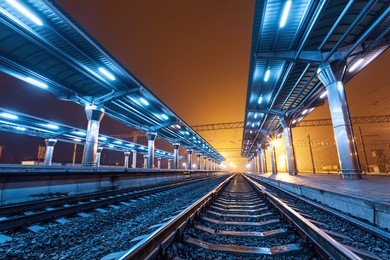 railway station at night. train platform in fog. railroad in donetsk