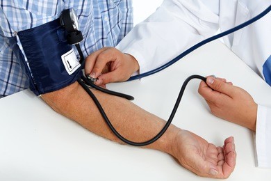 doctor checking old man patient arterial blood pressure. health care.