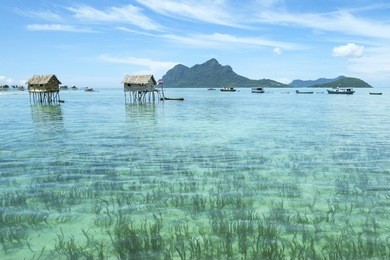 landscape view borneo sea gypsy water village in mabul maiga island, malaysia.