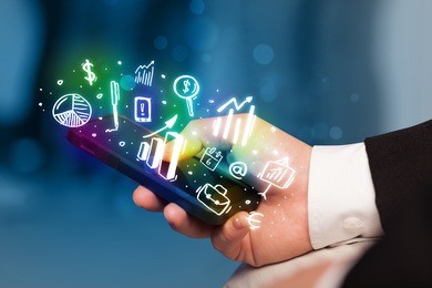 smartphone with finance and market icons and symbols concept