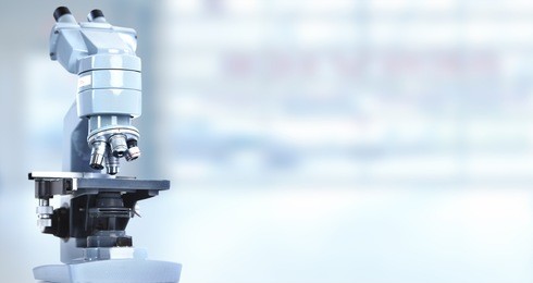 scientific microscope in laboratory. health care background.