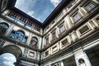 uffizi gallery under a cloudy sky in florence, italy