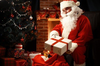 santa claus brought gifts for christmas and having a rest by the fireplace. home decoration.
