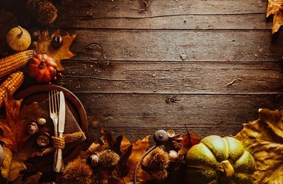 thanksgiving dinner. autumn fruit with plate and cutlery. thanksgiving autumn background