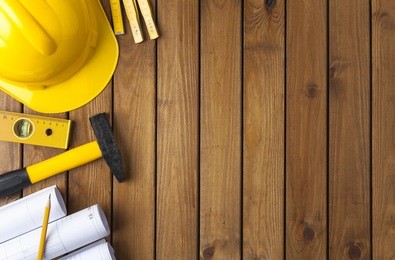 construction tools on a wooden background 