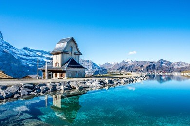 water reflection in  mountain lake above grindelwald, switzerland.