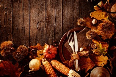 thanksgiving dinner. autumn fruit with plate and cutlery. thanksgiving autumn background