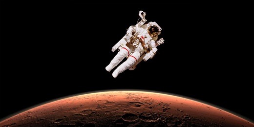 astronaut in outer space over planet mars. elements of the image are furnished by nasa