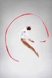 young gymnast jumping in the studio