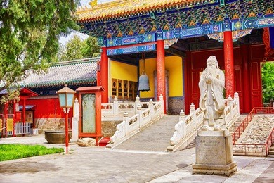 temple of confucius at beijing is the second largest confucian temple in china. translation inscription "big xu gate",under monument translation-"statue of confucius, the great chinese philosopher ".