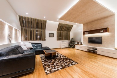 interior of a modern apartment with christmas tree in the evening
