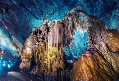 artificially highlighted limestone formations in the cave named paradise. phong nha region of vietnam