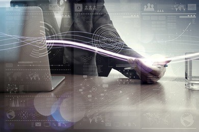 waves of blue light and businessman using on laptop computer with digital layer effect as concept                