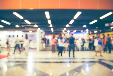 blurred image of shopping mall and people for background usage 