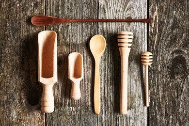 wooden kitchen utensils on old wooden background