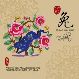 12 chinese zodiac signs of rabbit with chinese calligraphy text and the translation. auspicious chinese seal (top) good luck and happiness to you and (bottom) rabbit.