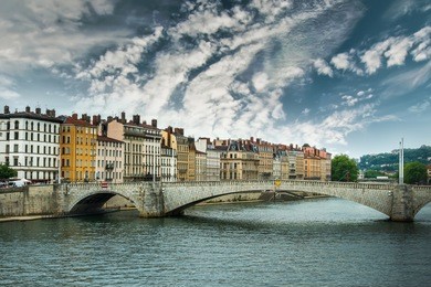 view from river sona to the bonaparte bridge and lyon city against sky, france